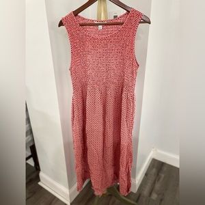 Sleeveless coral maxi dress.